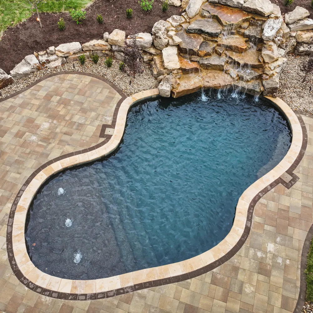 Aerial view of swimming pool with rock waterfall