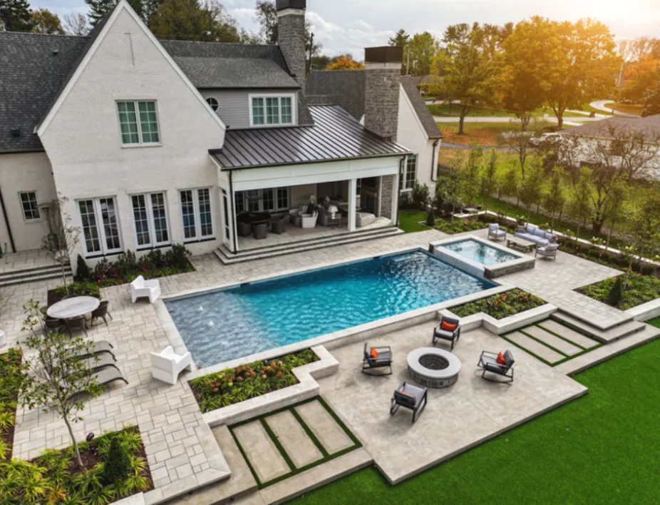 Aerial view of rectangular pool in the backyard of a house
