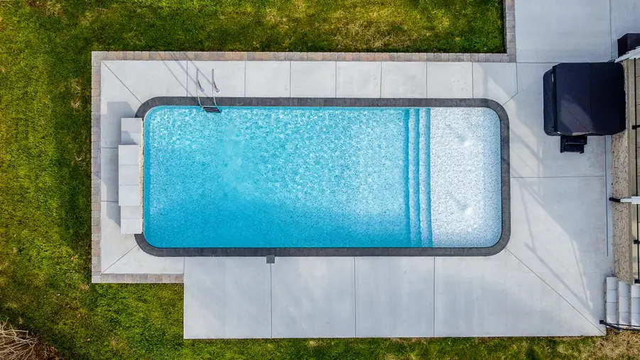An aerial view of a McKnabb-style fiberglass pool