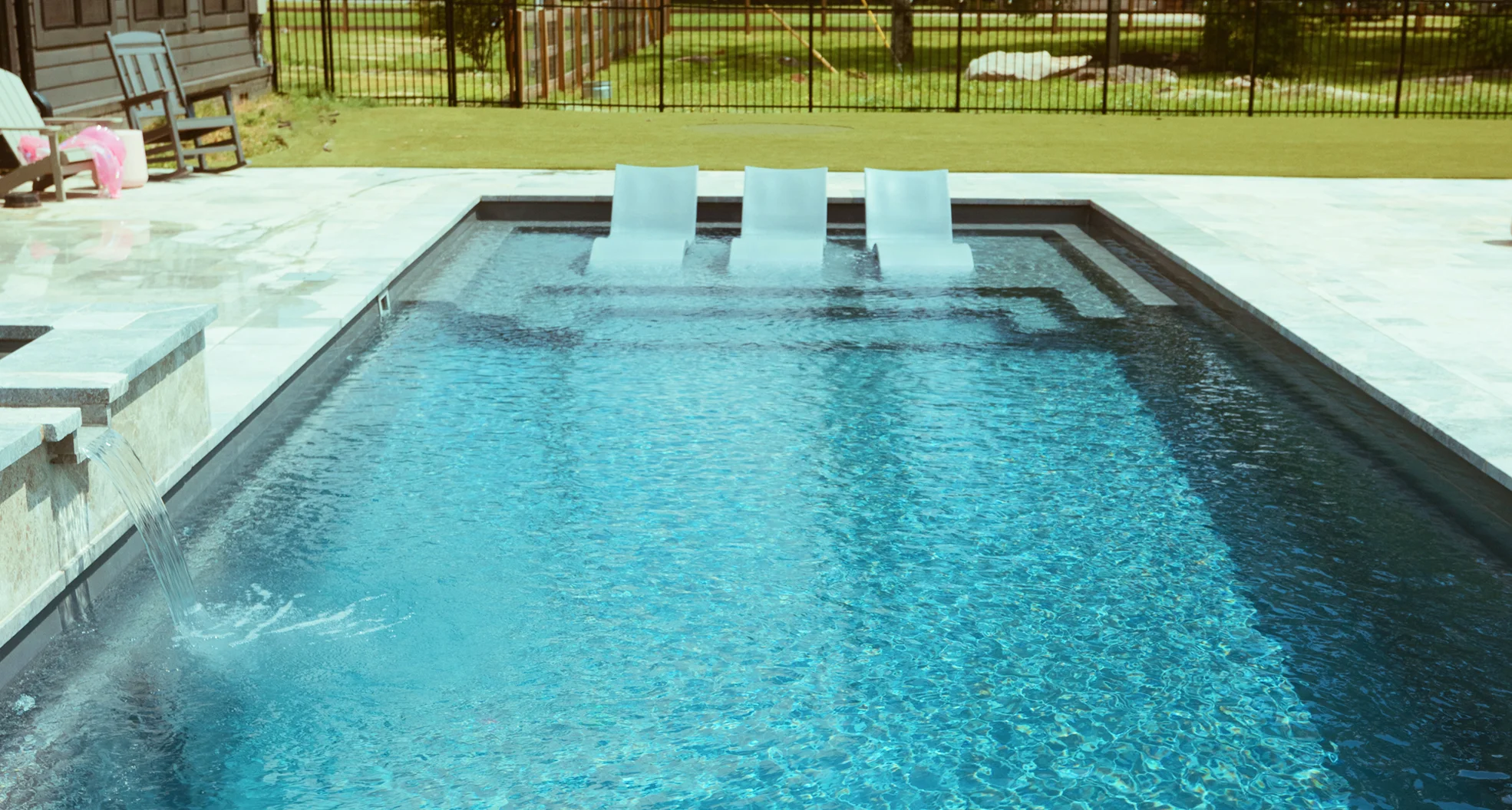 Backyard fiberglass pool highlighting safe conditions for swimming following the recommended post‑shock waiting period and water testing.