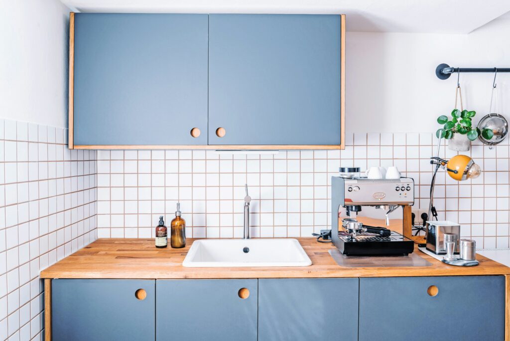 A blue wood-based kitchen area