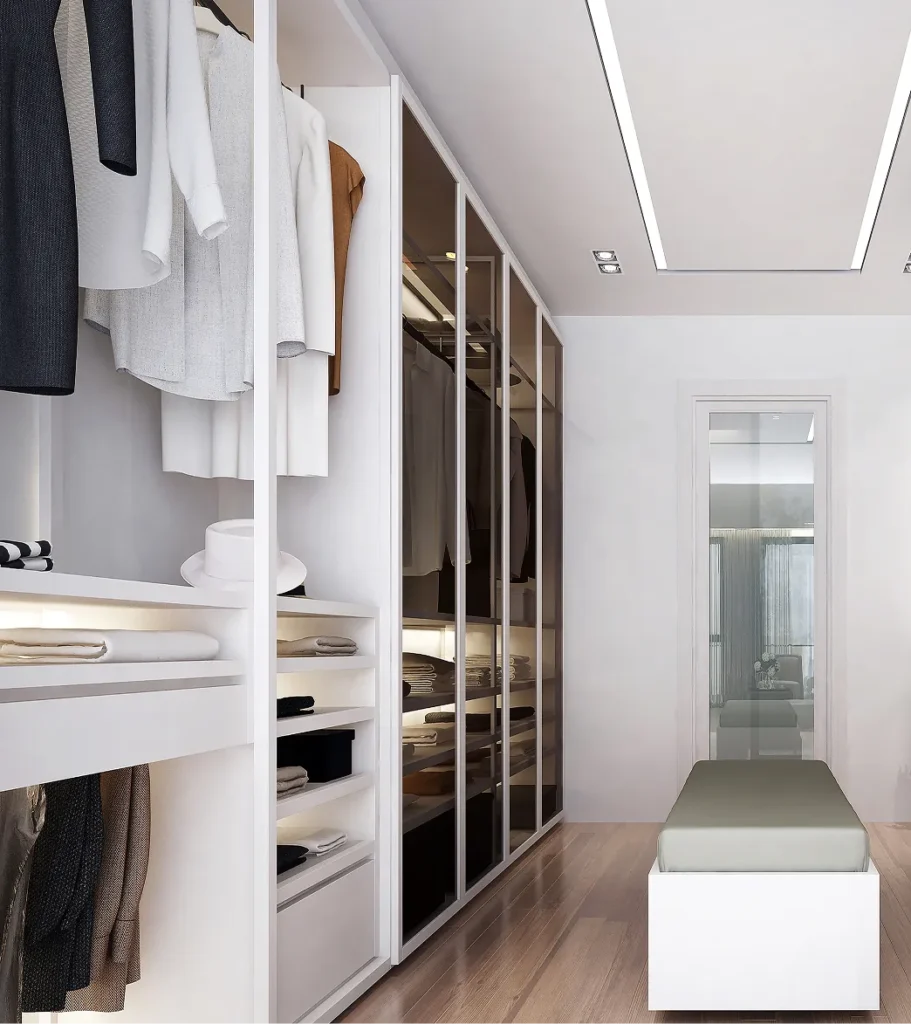 Bright custom walk-in closet addition with built-in shelving and modern finishes in a luxury home.