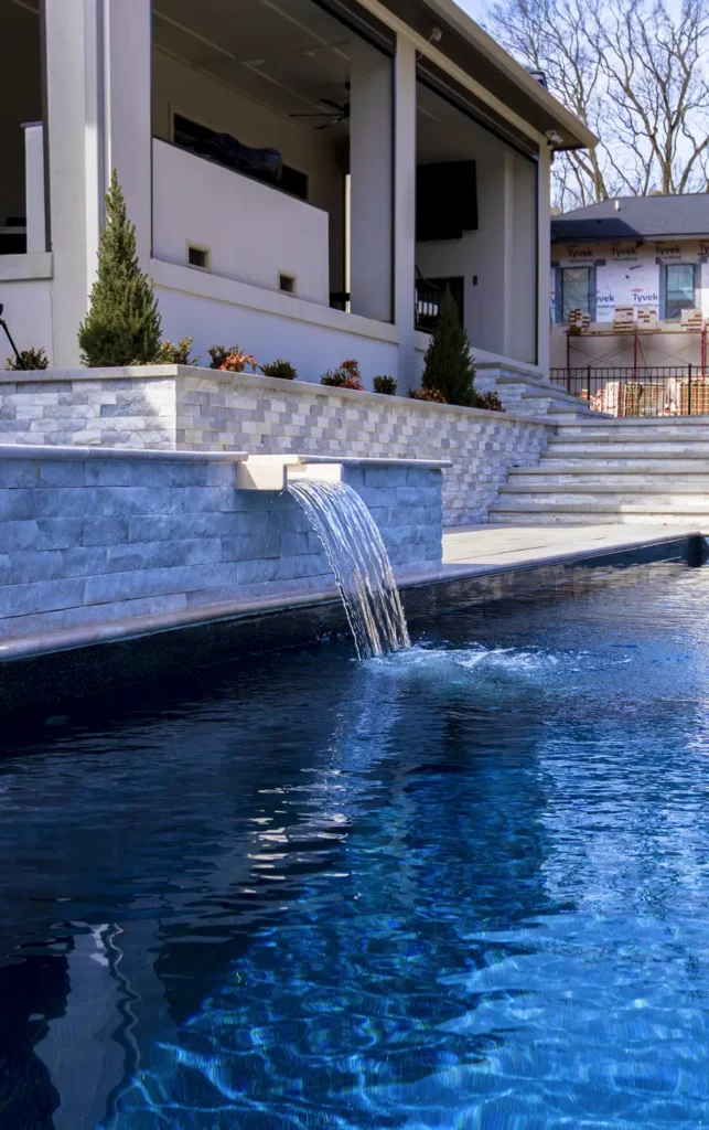 luxurious pool with a cascading waterfall